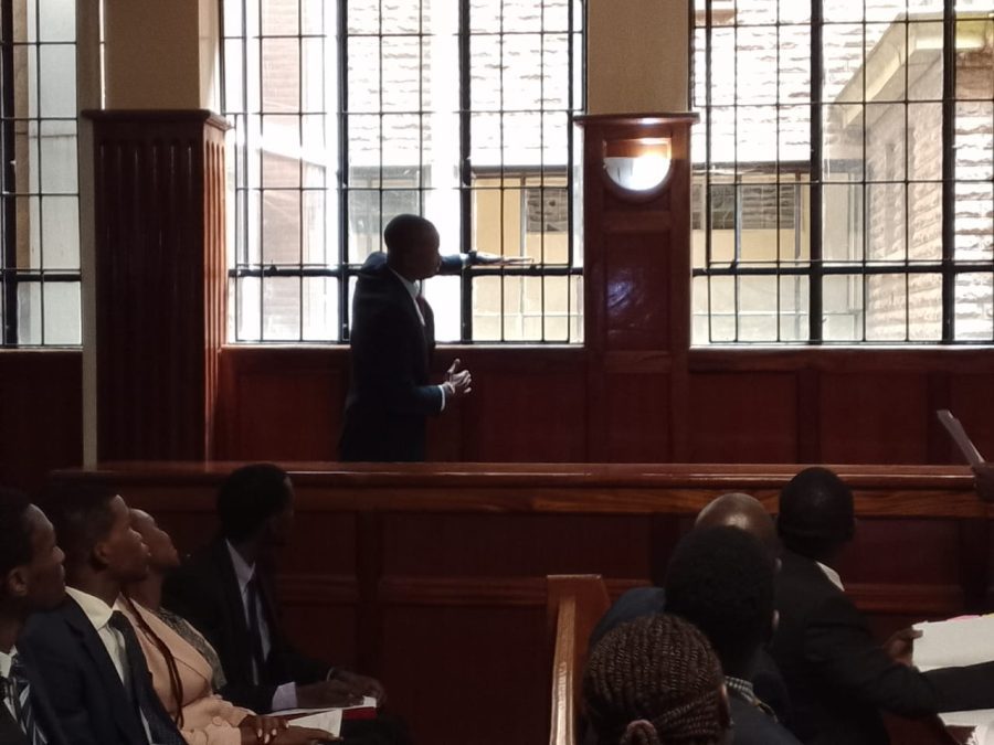 Samidoh demonstrating to Court on the size of the window grill the late Jeff Mwathi is said to have fallen from on Monday, August 11, 2025.PHOTO/Zipporah Ngwatu