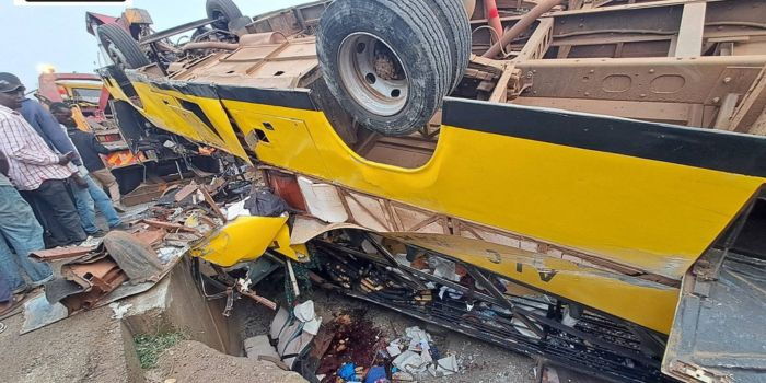 Kisumu residents mill around the wreckage of a school bus involved in an accident along the Kisumu-Kakamega highway on Friday, August 8, 2025. PHOTO/https://web.facebook.com/profile.php?id=100063981851831