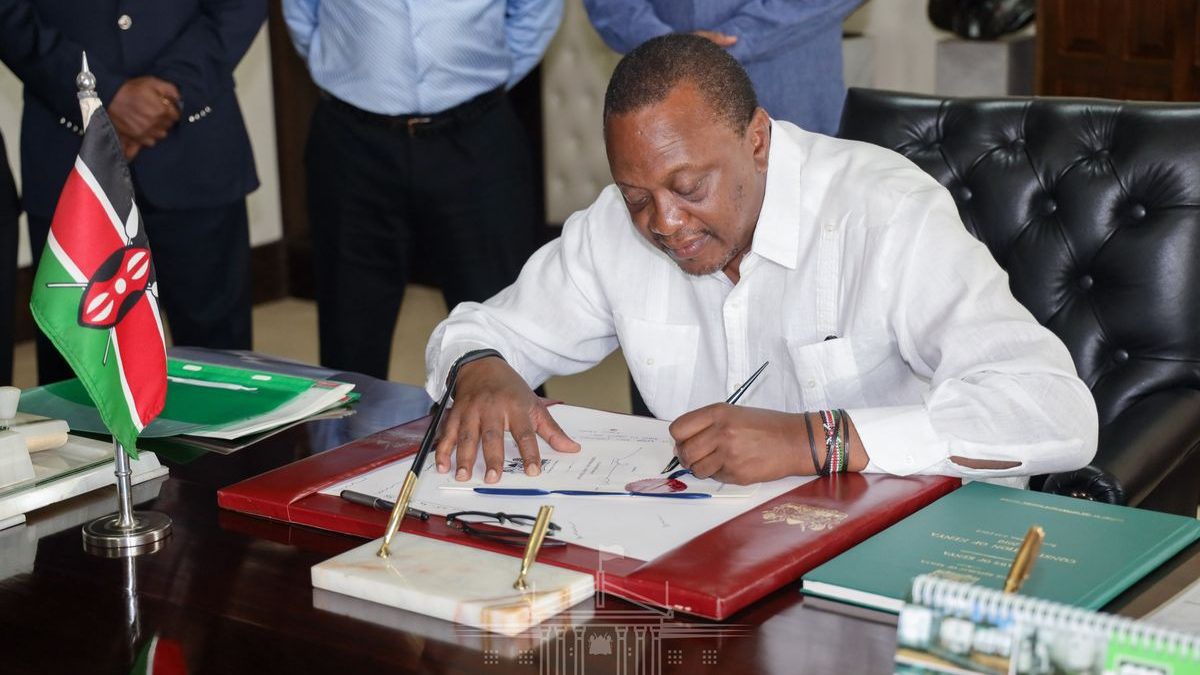 Former President Uhuru Kenyatta signs a past bill at State House Nairobi. PHOTO/Screengrab by K24 Digital.