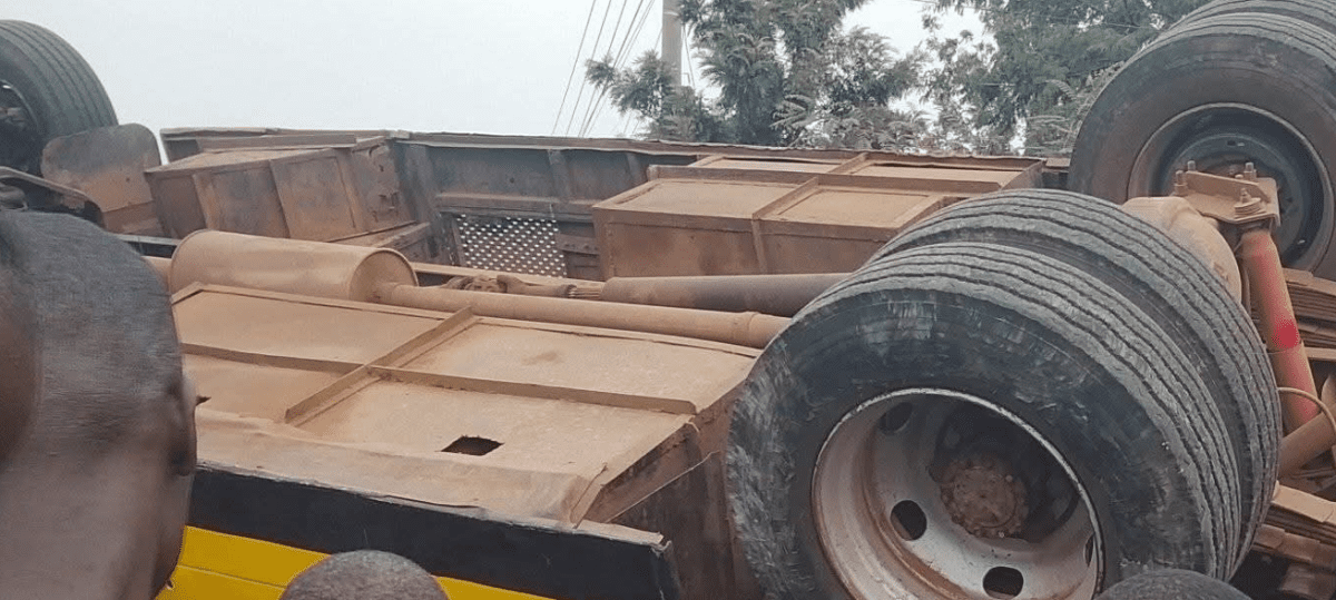 Kisumu residents mill around the wreckage of a school bus involved in an accident along the Kisumu-Kakamega highway on Friday, August 8, 2025. PHOTO/https://web.facebook.com/profile.php?id=100063981851831