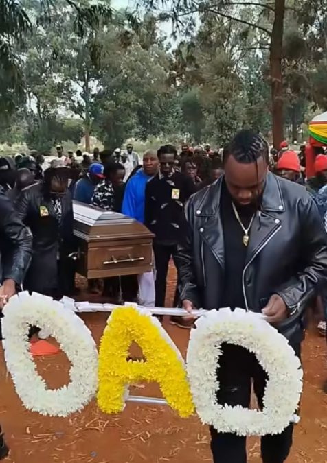 Mourners carrying MC Fullstop's casket inside Lang'ata cemetery on Tuesday, August 12, 2025. PHOTO/Screengrab by K24 Digital of Facebook video by @samule