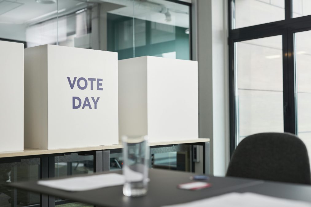 Big boxes with a sign Vote Day standing on table in an Office. Image used for illustration. PHOTO/Pexels