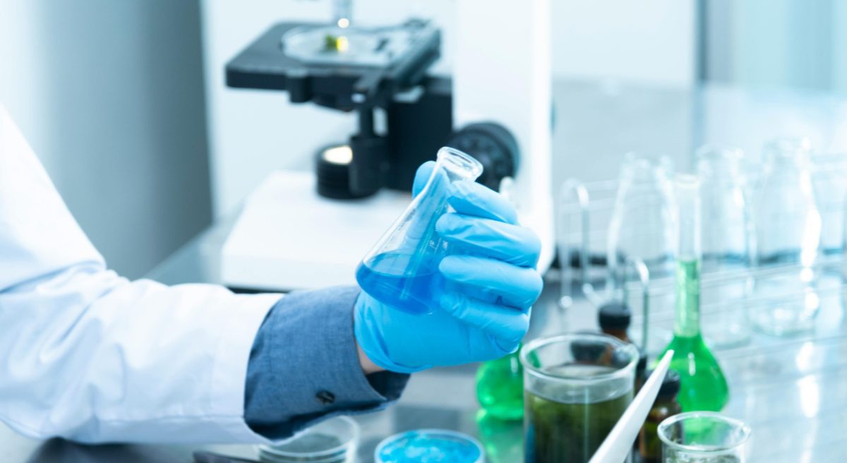 A person holding testing equipments in a laboratory. Image used for illustrations. PHOTO/Pexels