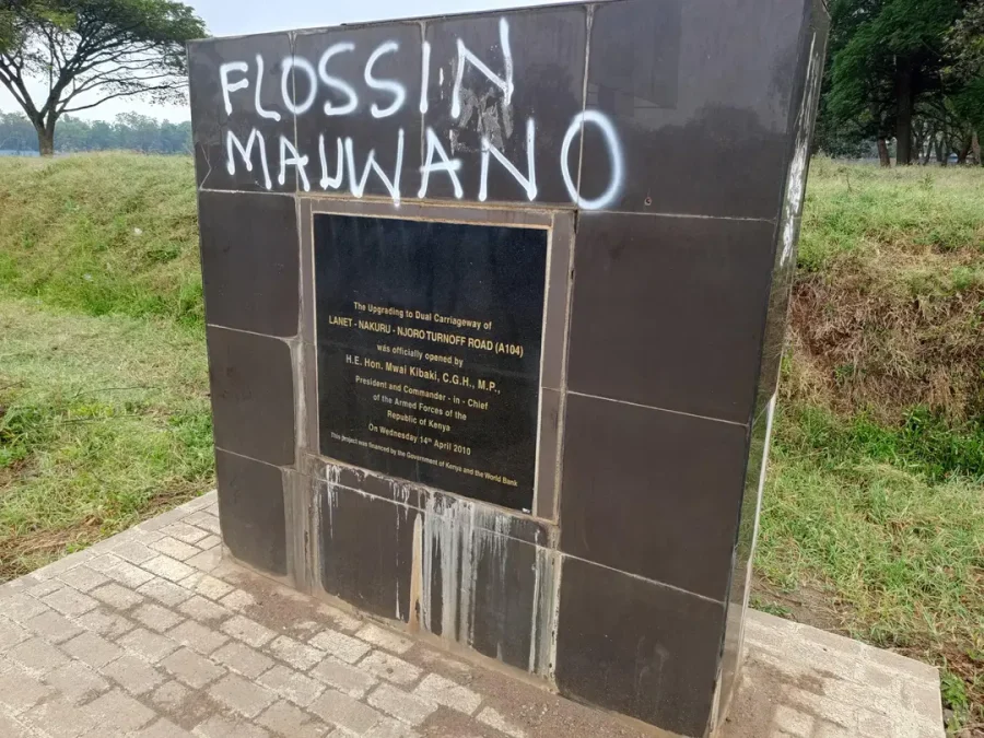 A project plaque wall with Flossin Mauwano graffiti scribbled across it. PHOTO/Screengrab by K24 Digital.