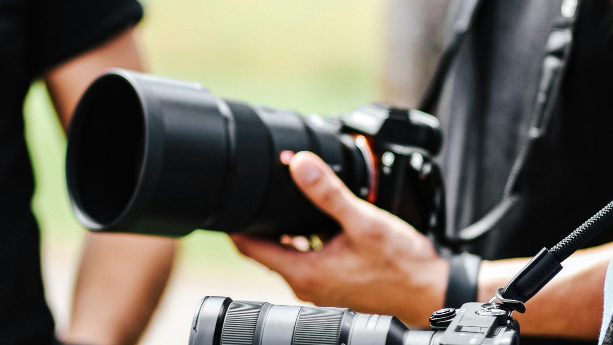People holding cameras. Image used for illustration purposes. PHOTO/Pexels