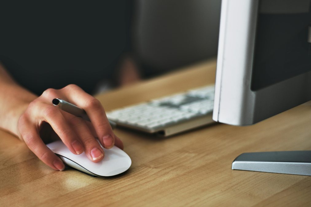 Someone operating a computer using a mouse. PHOTO/Pexels