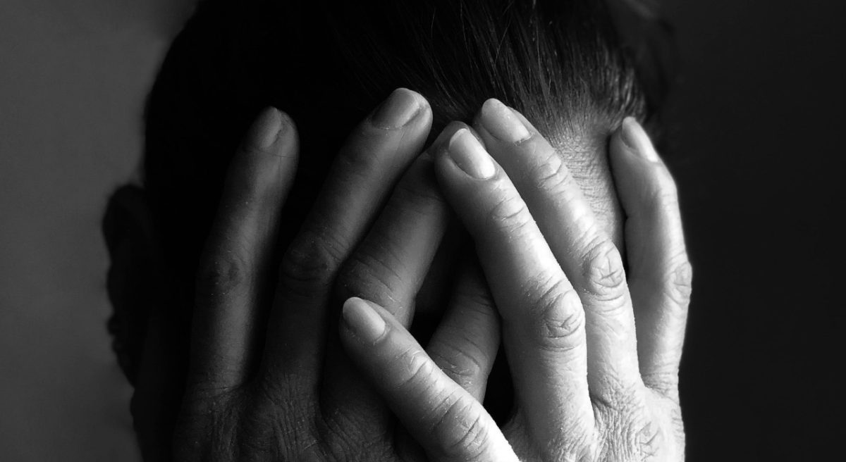 A woman hiding her face. Image used for illustration purposes. PHOTO/@Pexels