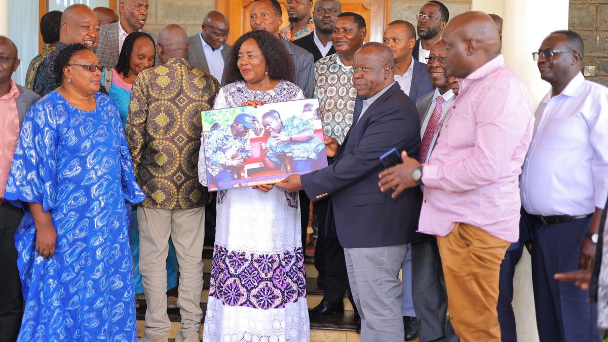 Matiang’i pays homage to Raila with special portrait gift to Ida Odinga