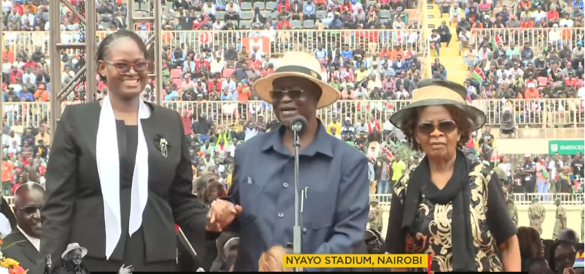 Oburu Odinga with his two wives during the State Funeral at Nyayo Stadium. PHOTO/Screengrab by K24 Digital