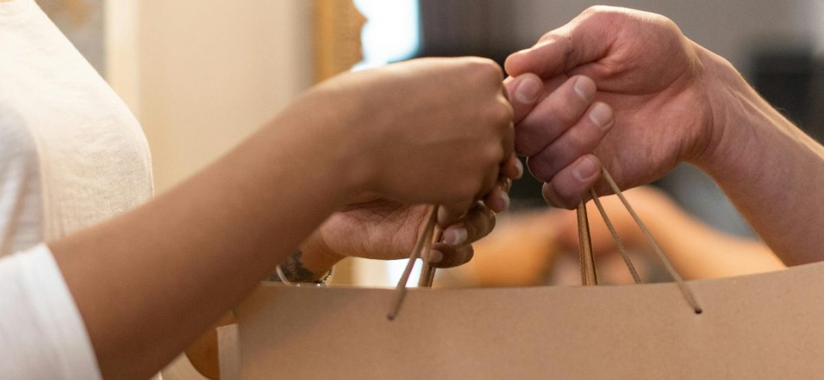 An imahge of two people exchanging brown gift bag. PHOTO/Screengrab by K24 Digital