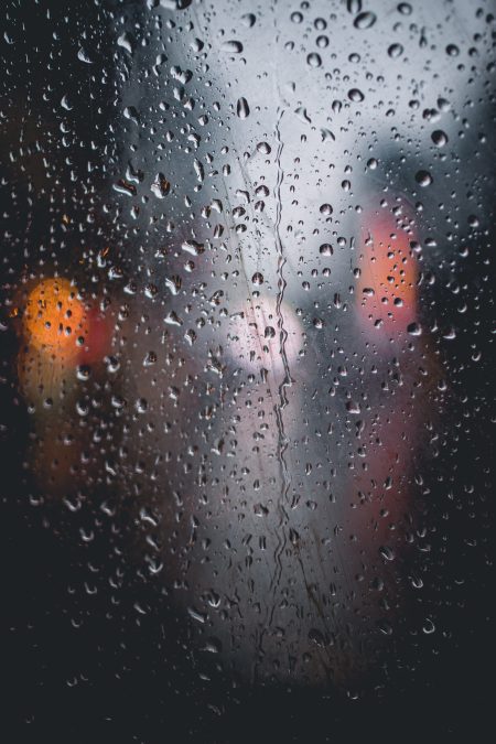 An image of rain drops in front of a mirror. PHOTO/Pexels