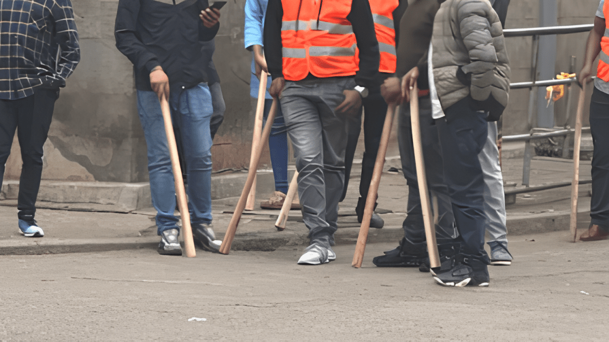 Men provide security with jembe sticks. PHOTO/Screengrab by K24 Digital