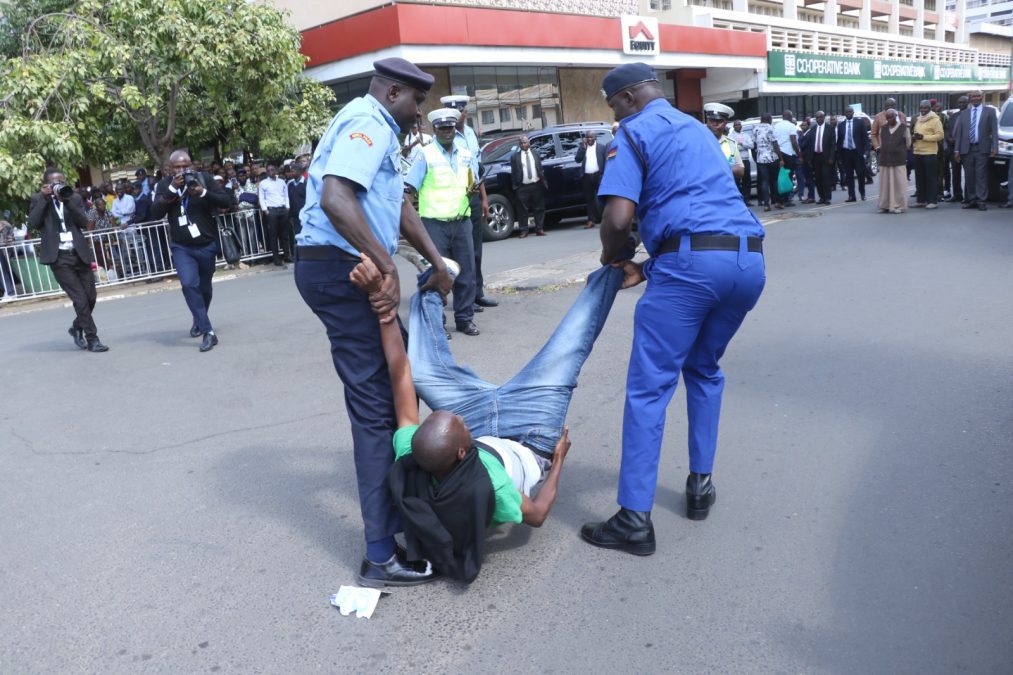 Activist Julius Kamau being whisked away by the police. PHOTO/Kenna Claude