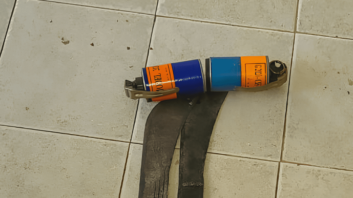 2 teargas cannisters placed ontop of pangas. PHOTO/@NPSOfficial_KE/X