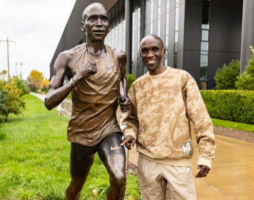 Eliud Kipchoge poses with his statue at Nike HQ in the US
