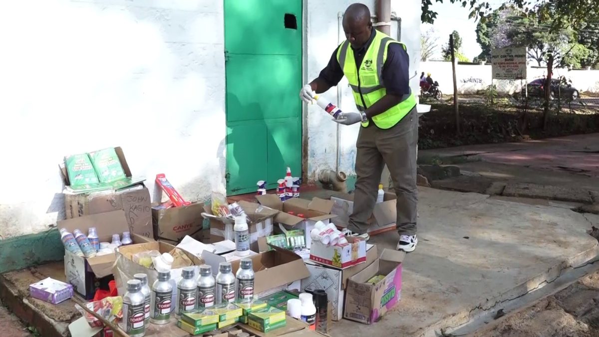 PCPB General Manager for Compliance and Enforcement Lawrence Kalawa displays fake pesticides. PHOTO/Brian Malila