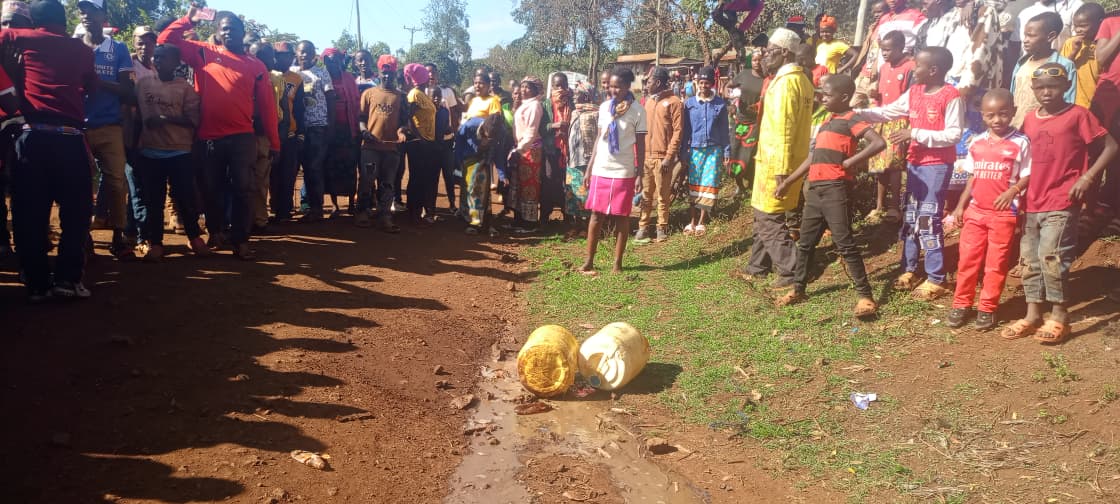 Villagers at Ngitana in Igembe North gather in disbelief at the illicit brewer's home, where two elderly men have died and five others left in critical condition after consuming the poisonous liquor. PHOTO/ Dorcas Mbatia
