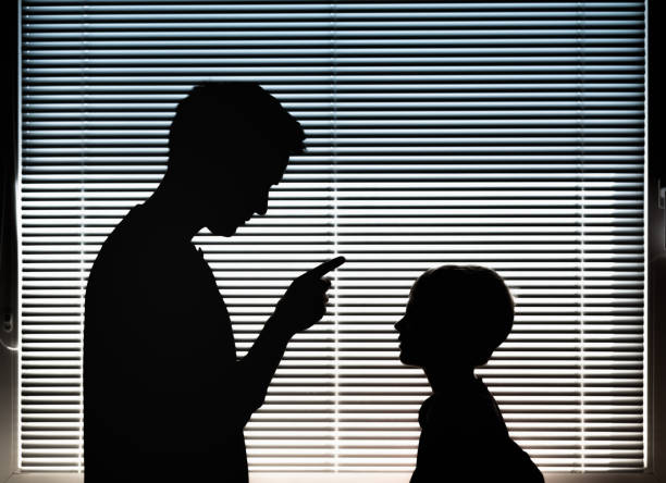 Elder man warns a littled boy. PHOTO/Pexels