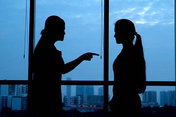 A silhouette of two women engaged in an argument. PHOTO/Pexels