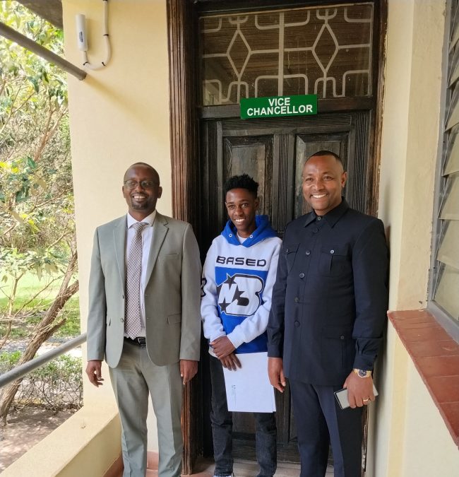 Kaluma Boy poses with East Africa University Vice Chancellor Christopher Mutembei and JCM's Bishop Ben Kiengei during his admission on Monday, November 3, 2025. PHOTO/https://www.facebook.com/profile.php?id=61581859767084