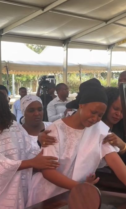 MC Pilipili's wife Philomena weeps during his burial.  PHOTO/@kingfreiz/Instagram