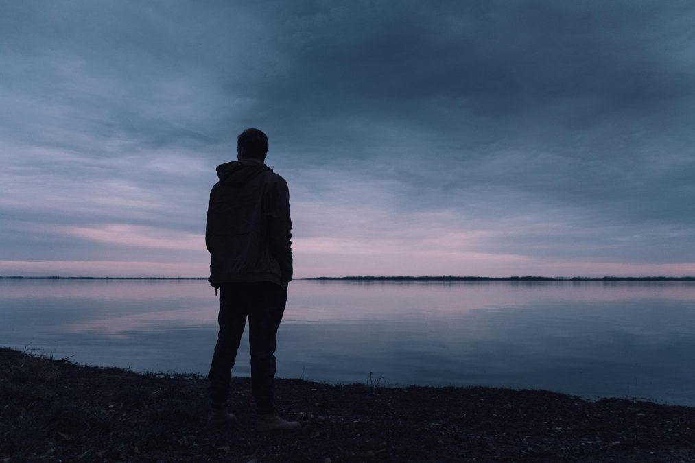 A photo of a man photographed just moments after the sunset. PHOTO/Pexels
