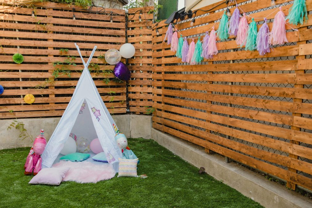Pink and white hammock on green grass field