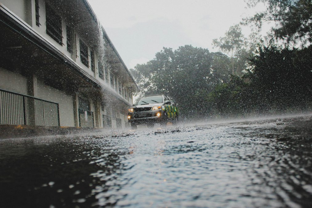 A car parked outside a house during heavy rainfall. Image used for illustration purposes. PHOTO/Pexels
