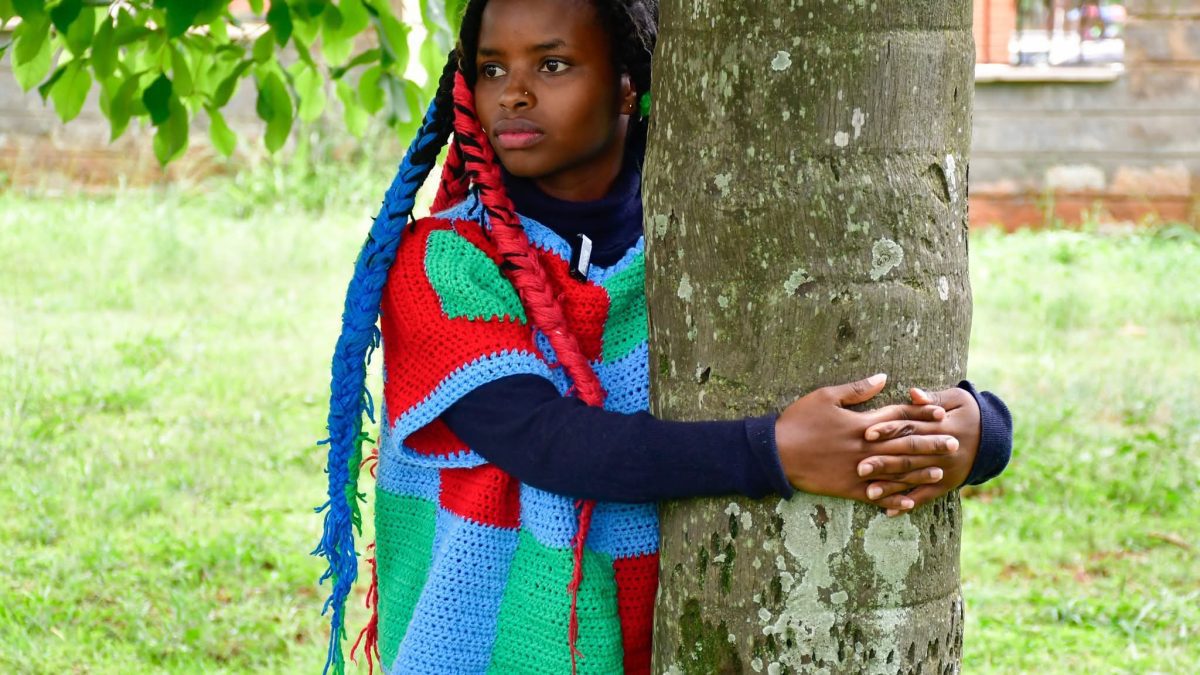 Truphena Muthoni hugging a tree.PHOTO/truphena_muthoni/Instagram