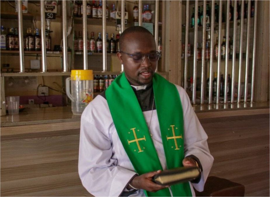 Padre Michael Watenga preaching at a wine and spirit shop. PHOTO/https://www.facebook.com/michael.kenson.7