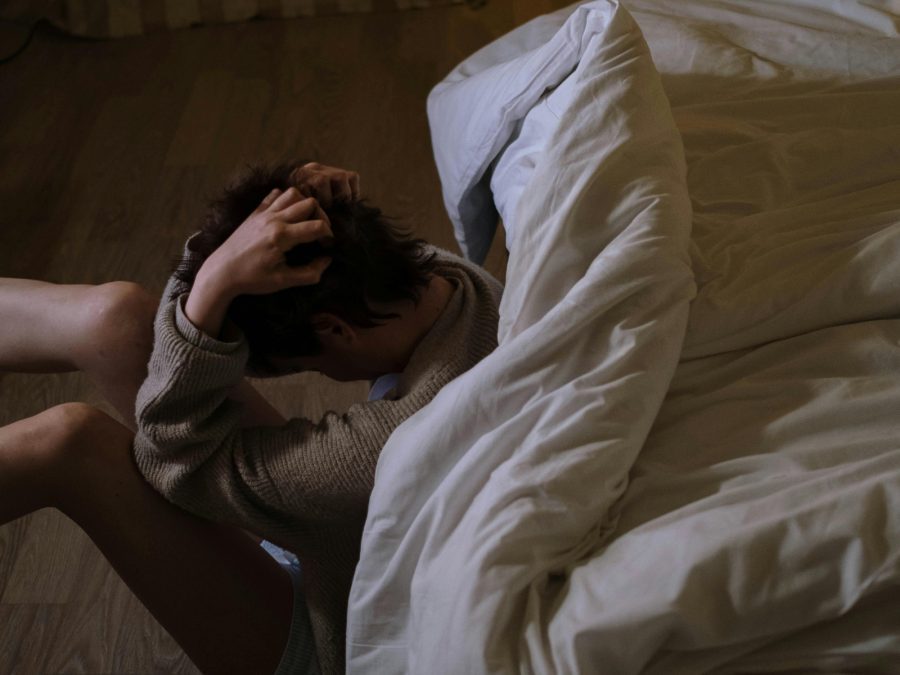 Photograph of a person with her hand on her head