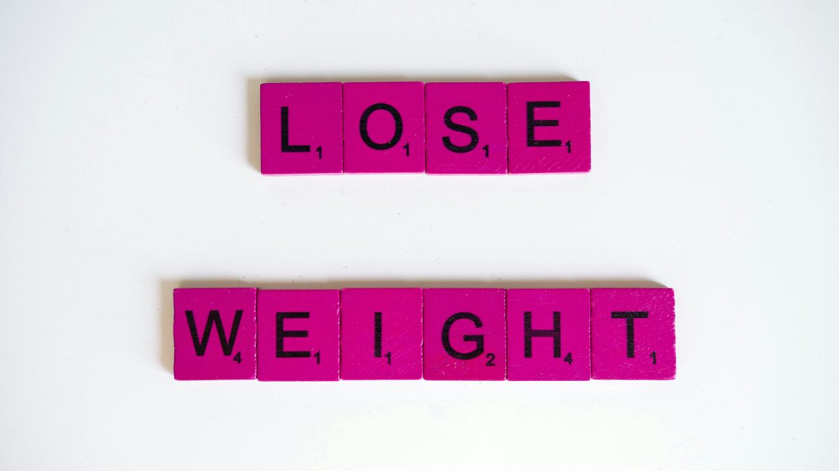 Scrabble tiles spelling the word weight loss on a pink surface, image used for representation purposes in this article.