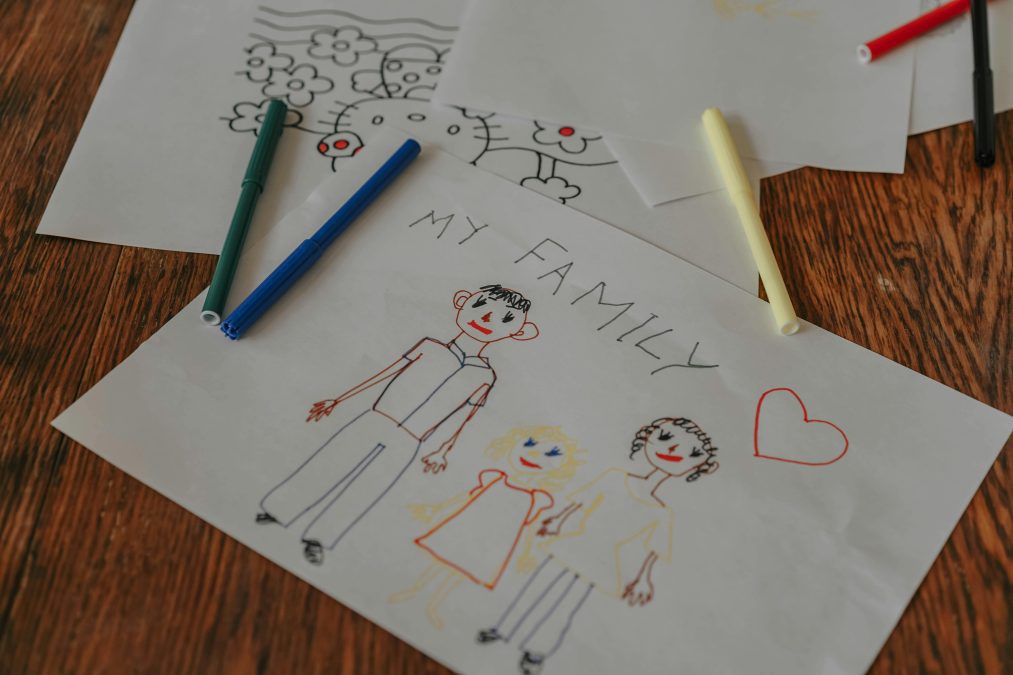Close-up of a child's drawing of a family on paper. Image used for illustration purposes. PHOTO/Pexels
