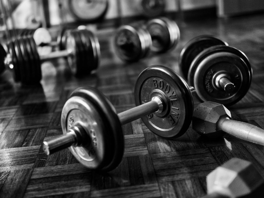 Grayscale photo of dumbbells on the floor. Image used for illustration purposes. PHOTO/Pexels
