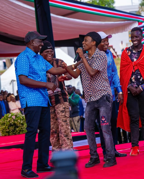 Kartelo speaking to President Ruto on stage
