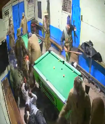 Police officers assaulting youth playing pool in Nandi County. PHOTO/Screengrab by K24