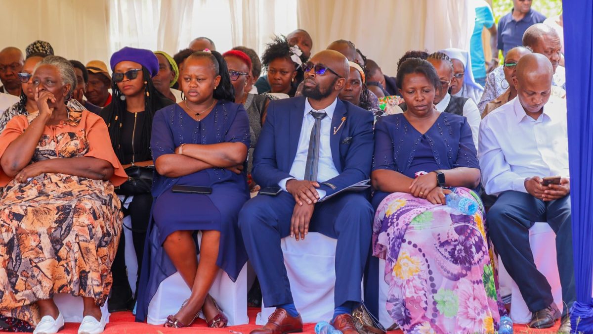 George Gathu's widow and other mourners during his burial at Kamunyaka grounds in Mathira Constituency. PHOTO/Loise Wambugu