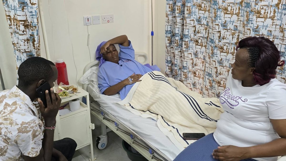 Essy Wa Milly sleeps on a hospital bed as her family members comfort her. PHOTO/https://www.facebook.com/profile.php?id=100084438489643