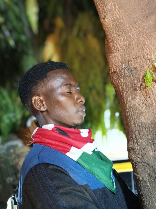 Pastor Jimmy Irungu during his tree-hugging feat. PHOTO/https://www.facebook.com/jymo.irungu