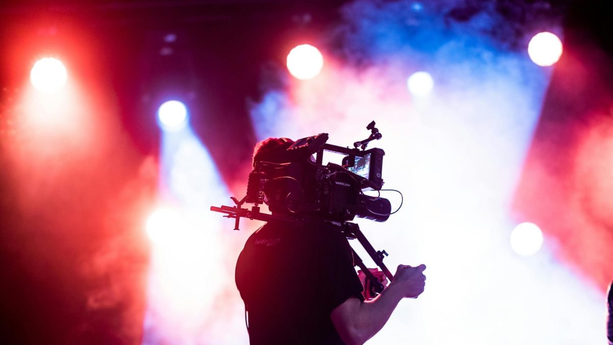 A person holding a camera. Image used for illustration purposes. PHOTO/Pexels