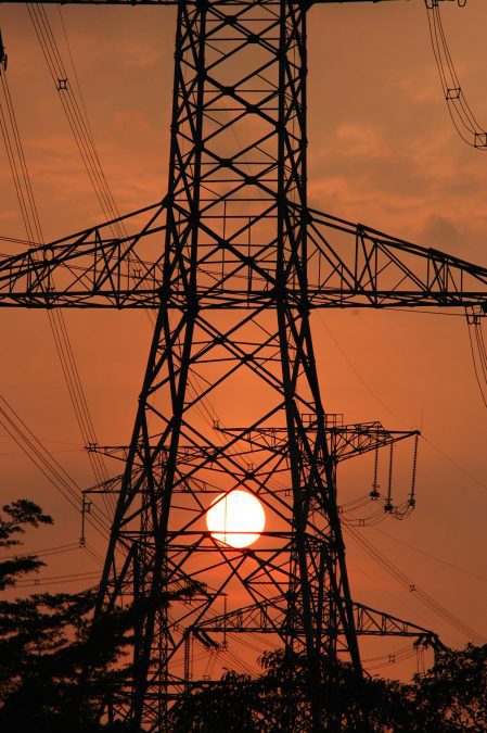 An Image captures electricity transmission after a sunset. Image is used for illustration. PHOTO/Pexels