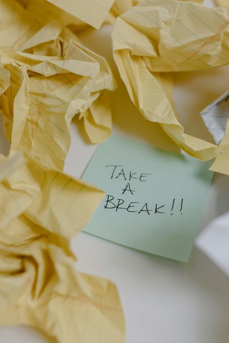 A sticky note around crumpled yellow papers. Image used for illustration purposes. PHOTO/Pexels

