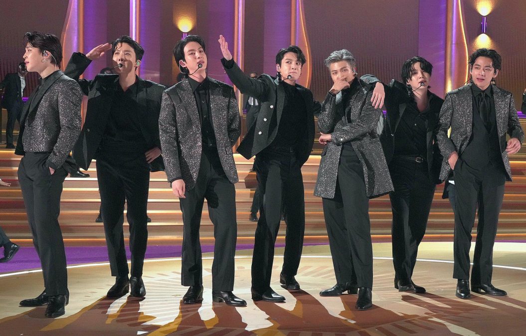 BTS members performing on a stage.PHOTO/www.grammy.com