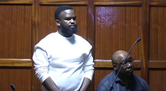 Jonathan Ngenga (Standing) and Peter Kamau appear before Milimani Chief Magistrate Lucas Onyina on Friday, February 20, 2026.PHOTO/Zipporah Ngwatu