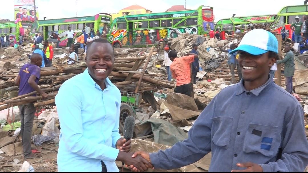 Kimani Wa Nduta with the microphone at Githurai market in Ruiru, Kiambu County. PHOTO/Mathew Ndung'u