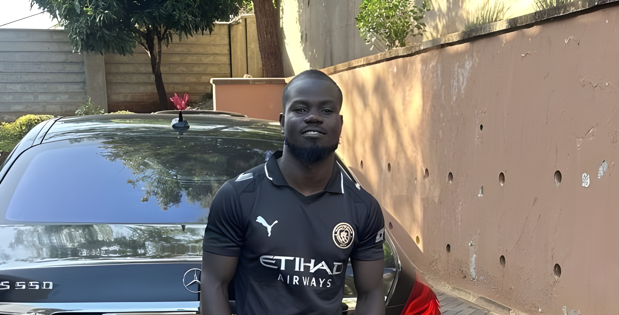 Mulamwah standing in front of his car. PHOTO/https://www.facebook.com/mulamwah