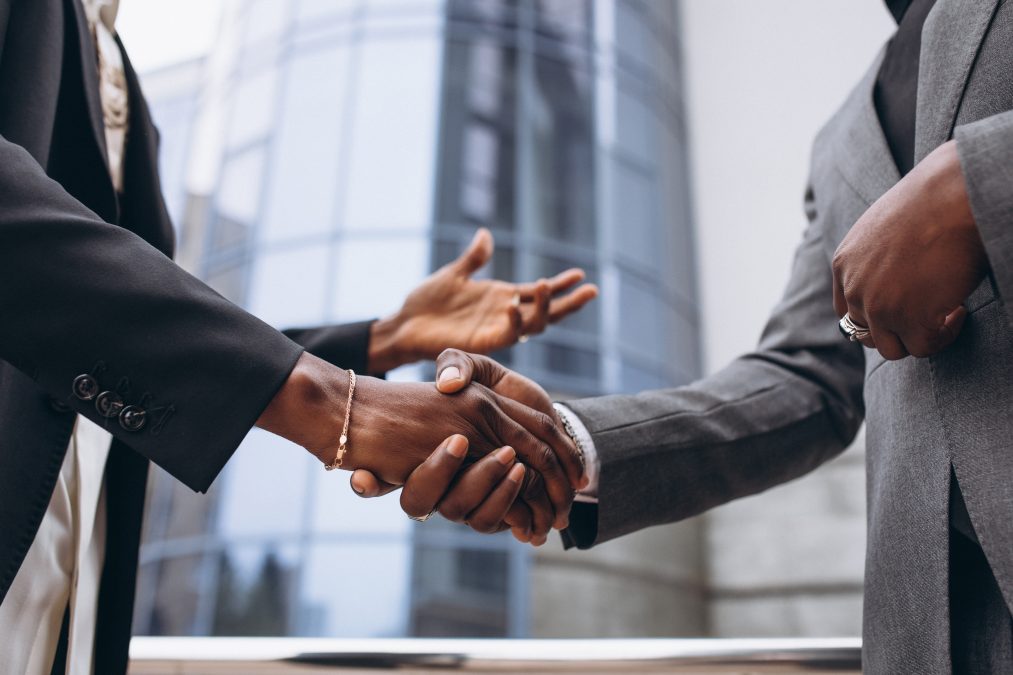 Two people shake each others' hand. PHOTO/Pexels
