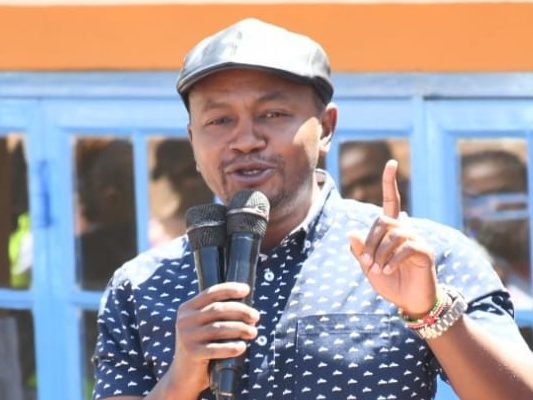 Kigumo member of parliament address the residents at Turuturu secondary school during the issuance of bursary as captured by Wanjira Njuguna. PHOTO/Wanjira Njuguna