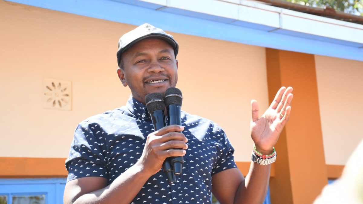 Kigumo member of parliament addresses the residents at Turuturu secondary school during the issuance of bursary as captured by Wanjira Njuguna. PHOTO/Wanhgari Njuguna