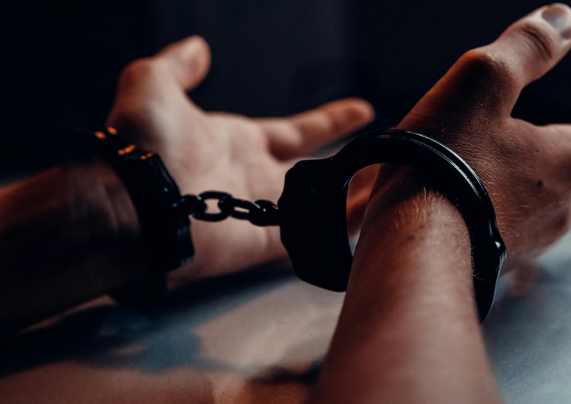 A handcuffed person. Image used for illustration purposes. PHOTO/Pexels